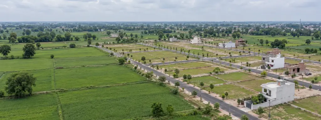 YEIDA Residential Sectors Explained: aerial view of a planned residential sector under development: straight internal roads