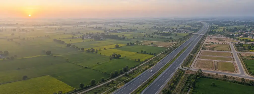 YEIDA Master Plan 2041: Yamuna Expressway through farmland with new sector plots being laid out